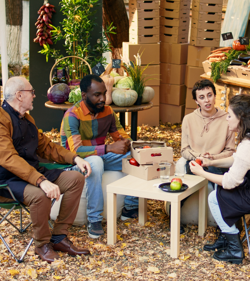 A group of people sitting around a table.